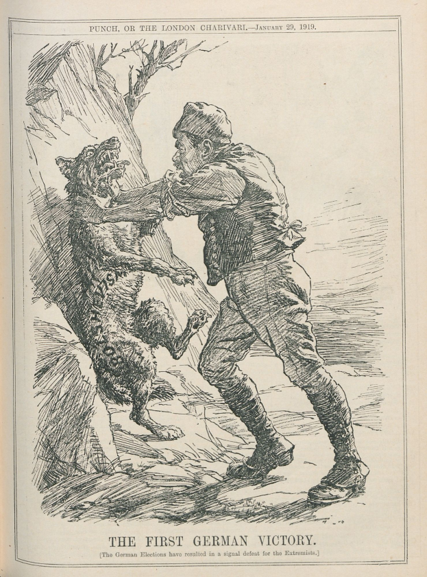 Ein aufgeschlagenes Buch mit einer Zeichnung eines Mannes mit Hut und entschlossener Miene sowie eines Hundes, der neben ihm steht und aufmerksam herschaut. Der Text auf dem Buch lautet 'Der erste deutsche Sieg'.