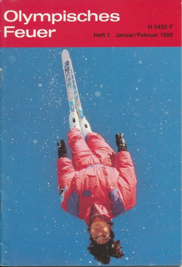 Buchumschlag mit der Aufschrift "Olympische Spiele Feuer - Heft 1 - Januar/Februar 1988" zeigt einen Skispringer in der Luft