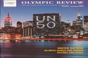 Ein Buch mit dem Titel "Olympic Review Official Publication of the Olympic Movement" mit einer Stadtansicht auf dem Cover, das auf einer flachen Oberfläche liegt.